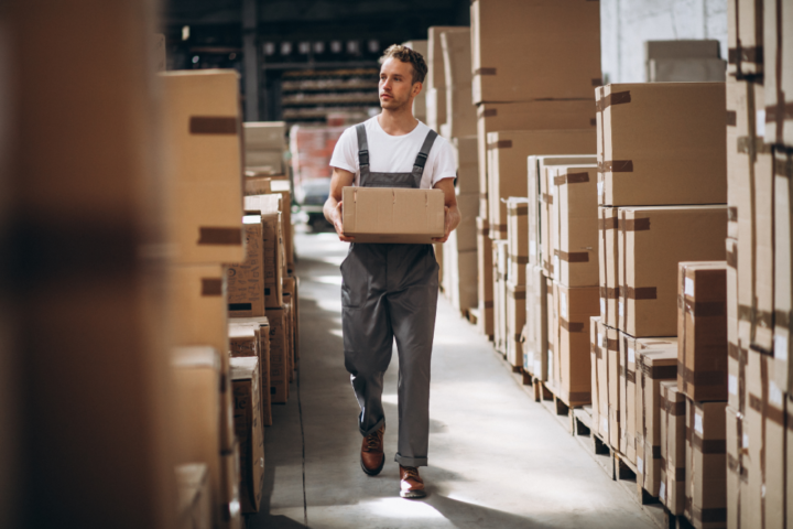 young-man-working-warehouse-with-boxes (3)